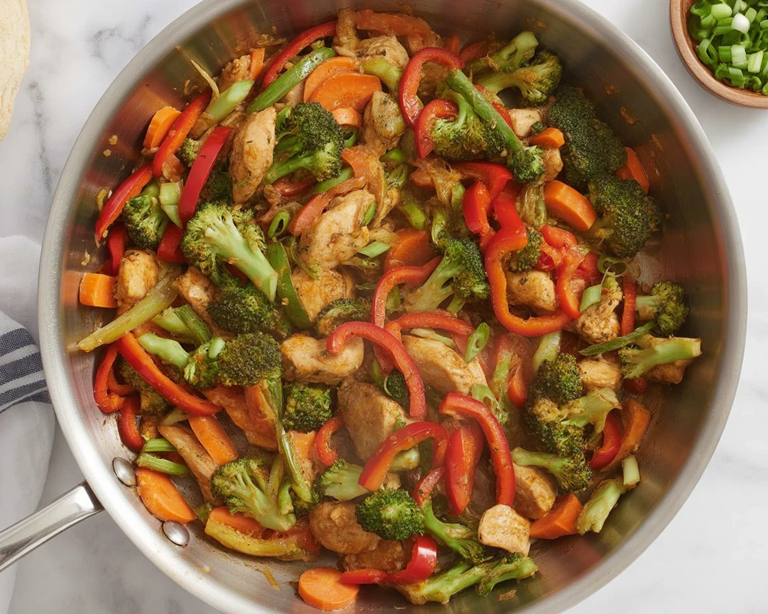 Budget-Friendly Chicken & Veggie Stir-Fry with fresh ingredients and savory sauce.