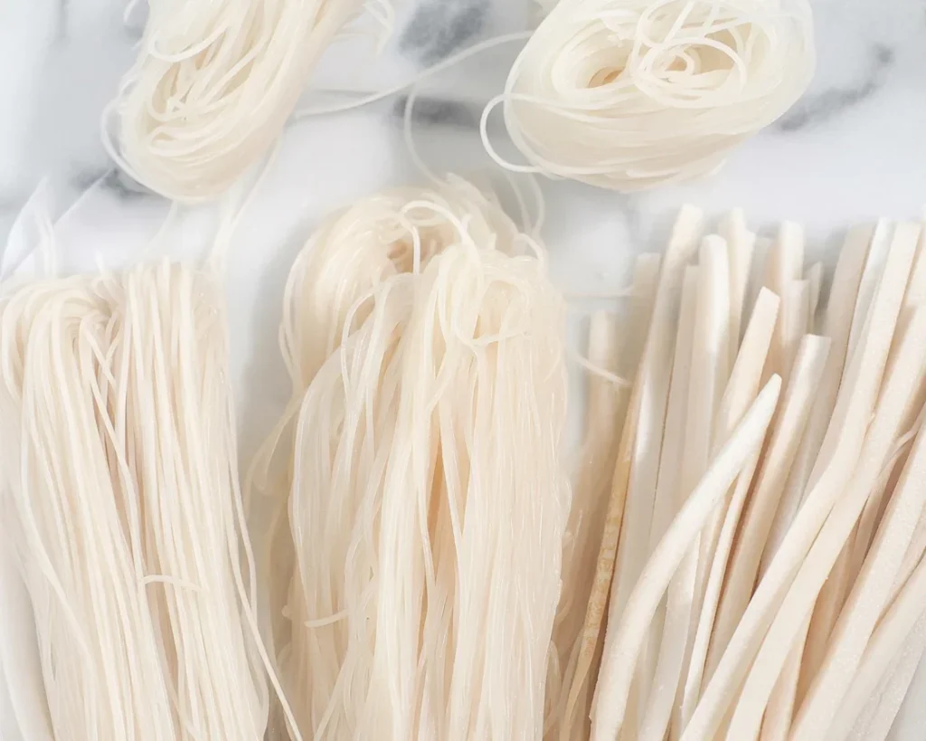 A bowl of perfectly cooked rice noodles, ready for stir-fry and sauces.